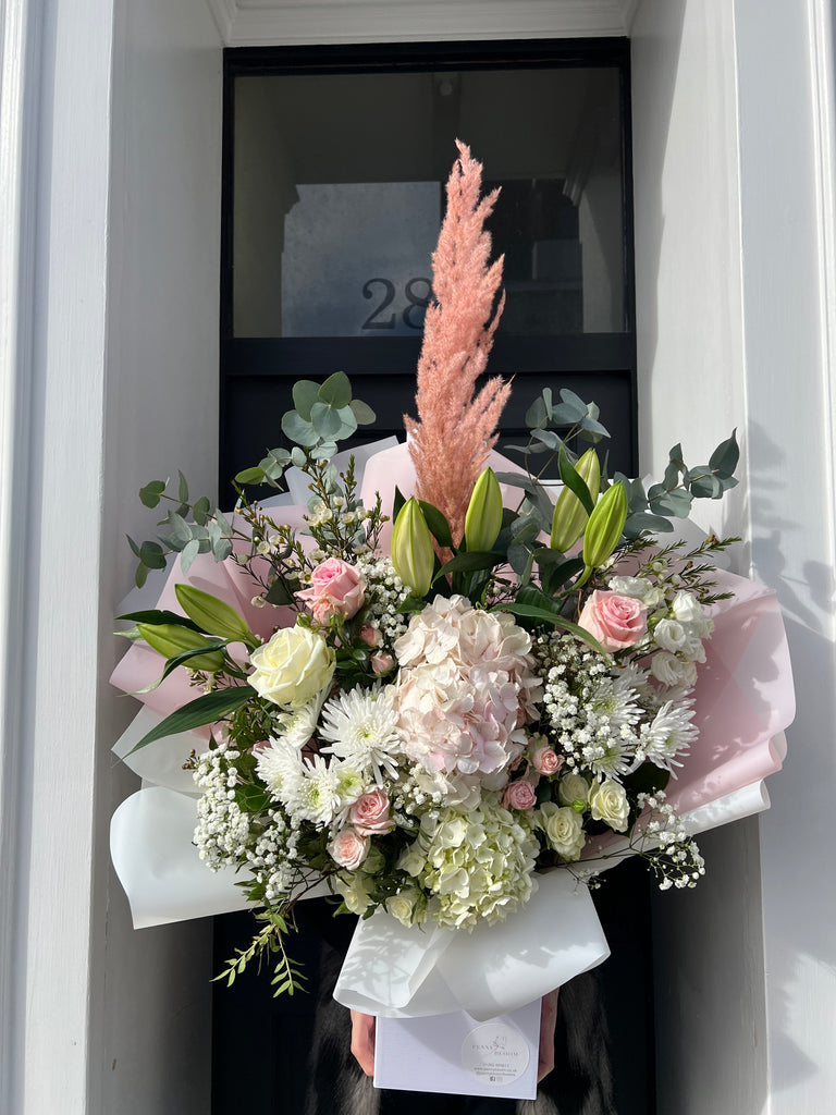 large bouquet with pink pampas and hydrangeas and lillies