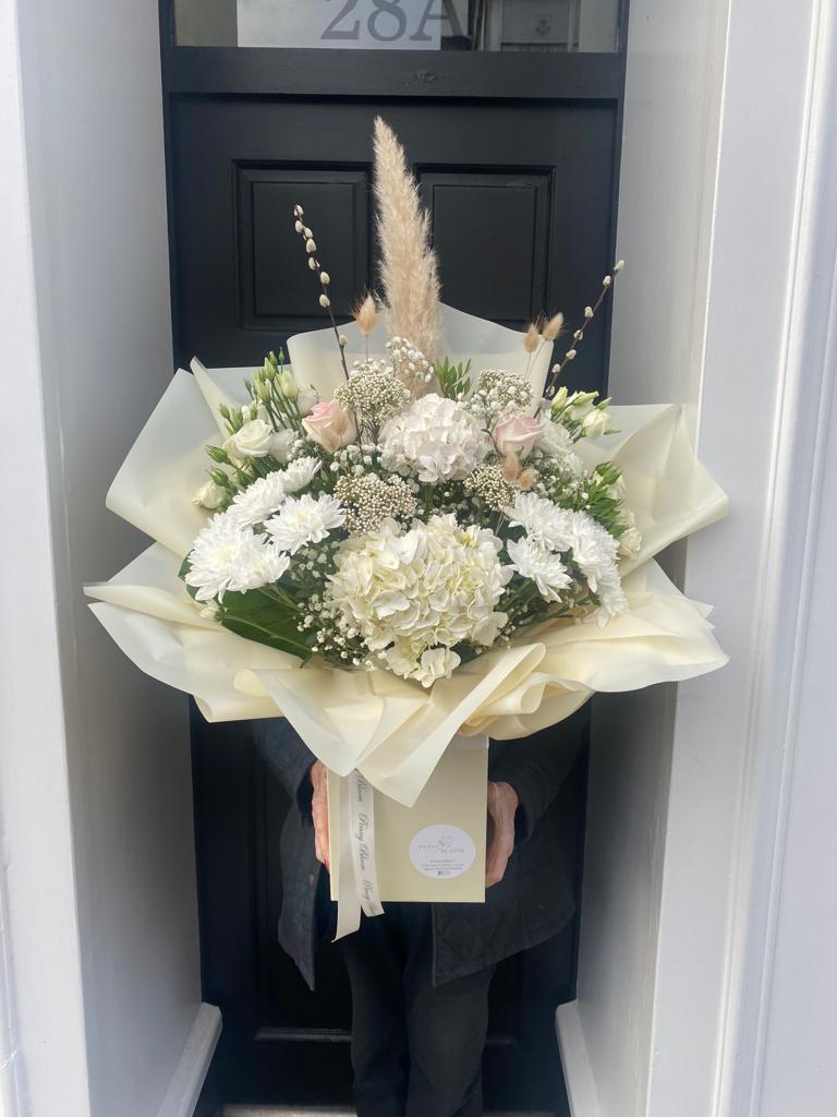 white and cream flower bouquet with pampas grass