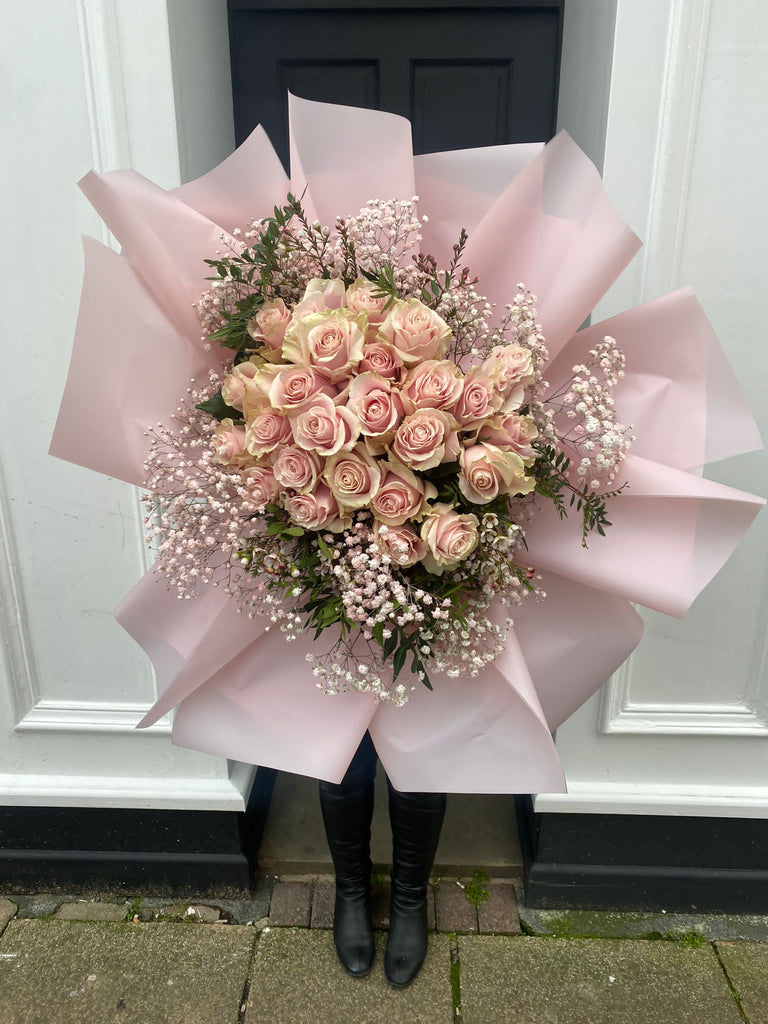 pink rose dome surrounded by gypsophillia