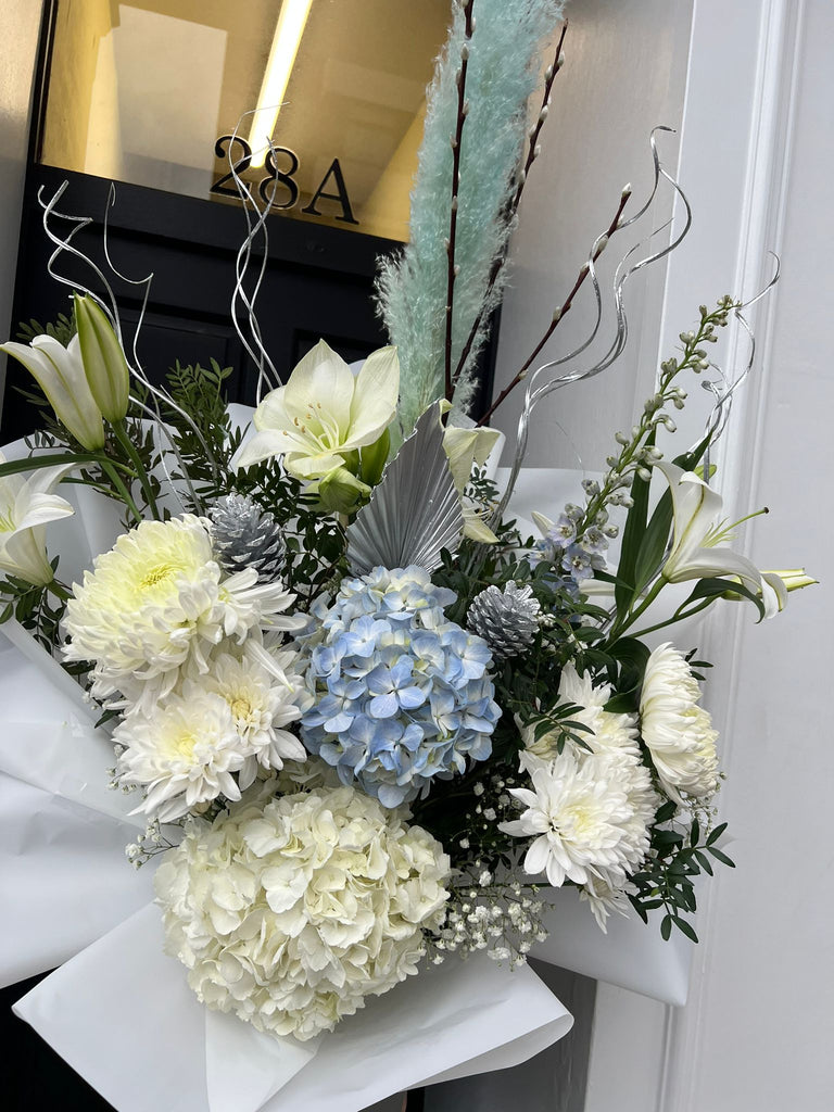 white and blue luxury bouquet with christmas acorns and glitter